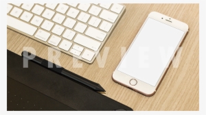 White Iphone Mockup Resting Beside An Imac Keyboard - Laptop