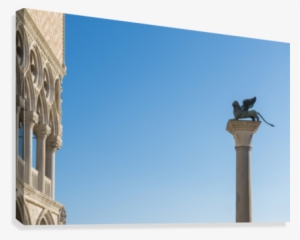 Statue On Top Of A Column Monument Against A Blue Sky - Printscapes Wall Art: 18" X 12" Canvas Print With Black