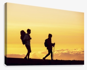 Silhouettes Of Two Hikers With Backpacks Walking At