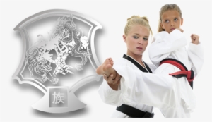 Instructor Teaching Girl How To Karate Kick - Edmonton