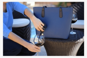 Woman Pouring Wine From Blue Portovino Wine Purse - Wine Purse - Portovino Handbag