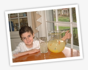 Alexandra Scott At A Kitchen Table With Pitcher Of - Alex Lemonade Stand