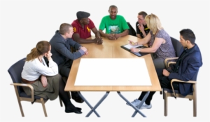 Group Of People Sitting Around A Meeting Table