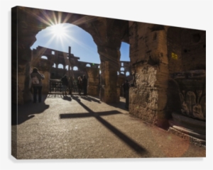 Sunburst Through An Archway At The Colosseum And A