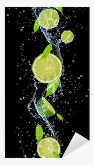 limes in water splash, isolated on black background - background water & lime