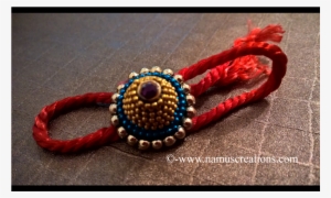 Golden And Blue Ball Chain With Golden Moti Rakhi - Quilling