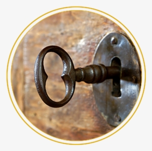 Closeup Of An Old Keyhole With Key On A Wooden Antique