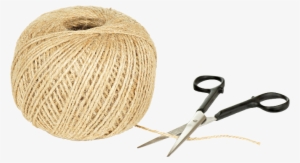 A Ball Of Beige Yarn And A Pair Of Scissors With Black - Yarn