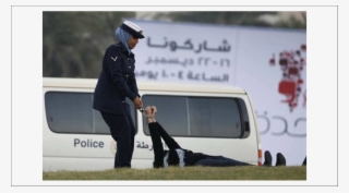 A Police Officer Drags Zainab Al-khawaja After Handcuffing - Zainab Al Khawaja