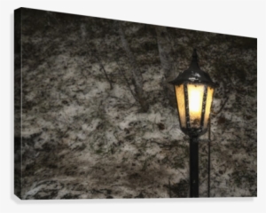 Illuminated Lamp Post Against A Stone Wall