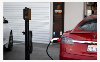 Juicebox Pedestal Charging A Tesla - Executive Car